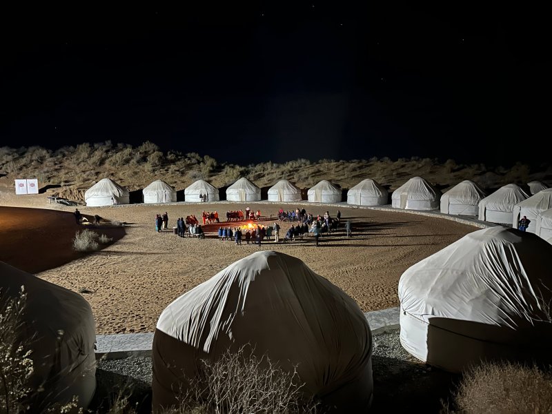 Night view of Aydarkul Yurt Camp with traditional yurts 